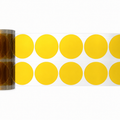 Amber die-cut Kapton dots on a clear release liner